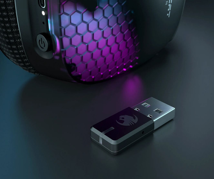 An earcup next to a wireless transiver